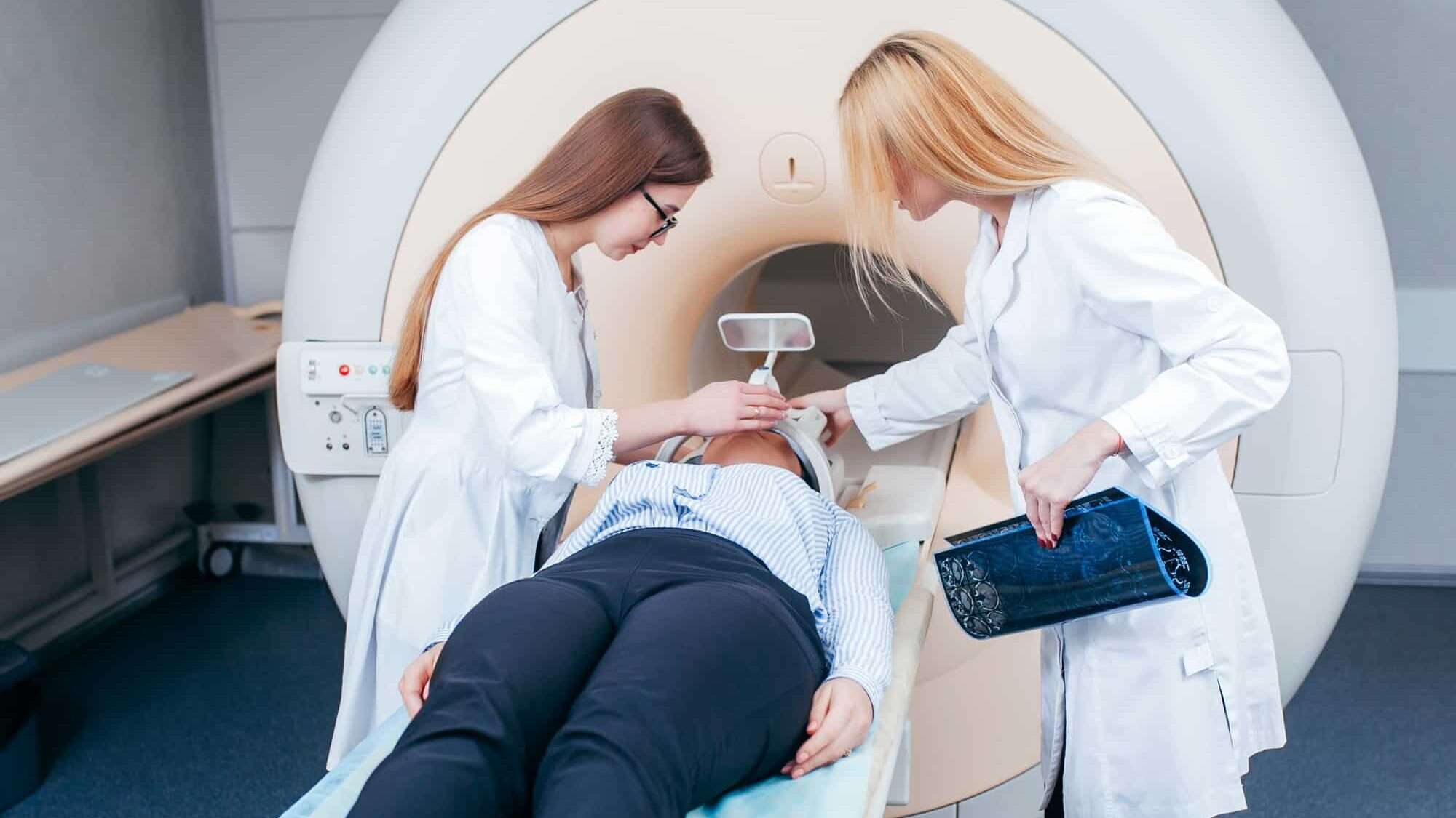 Medical Radiology Technicians preparing a patient for a scan.